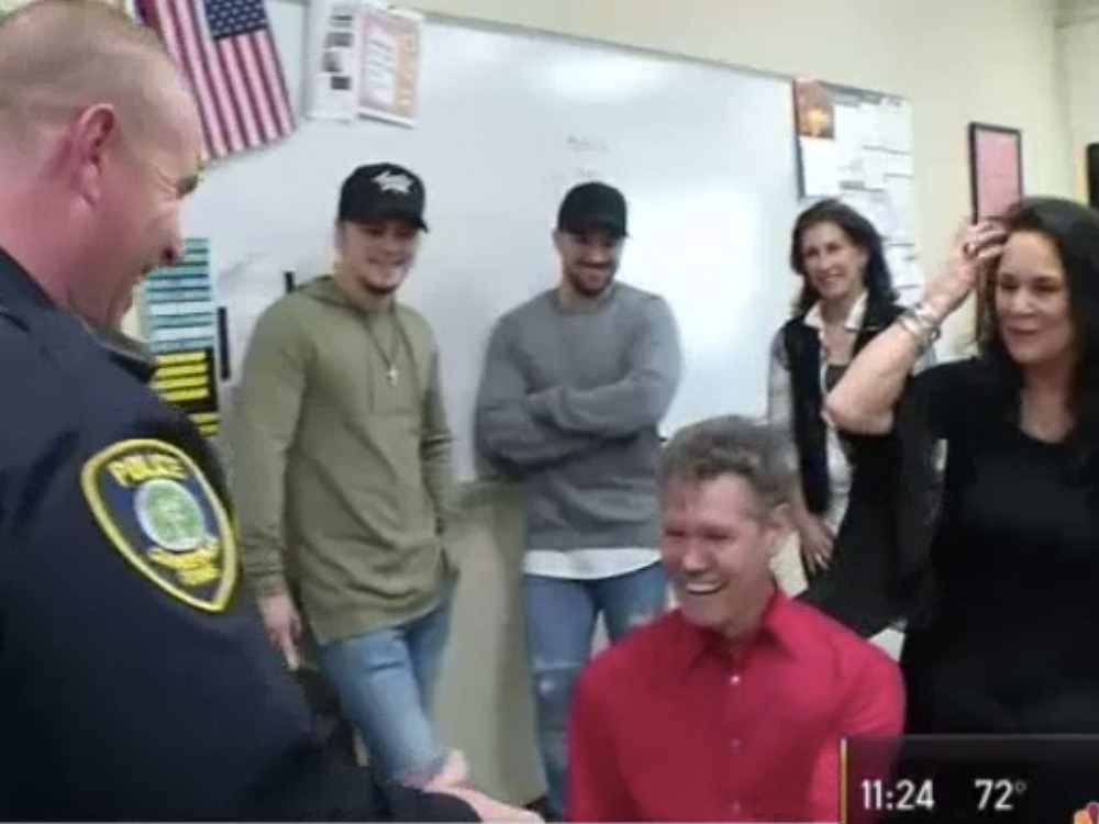 Watch Randy Travis Surprise a Texas Police Officer With a New Gibson Guitar for Christmas
